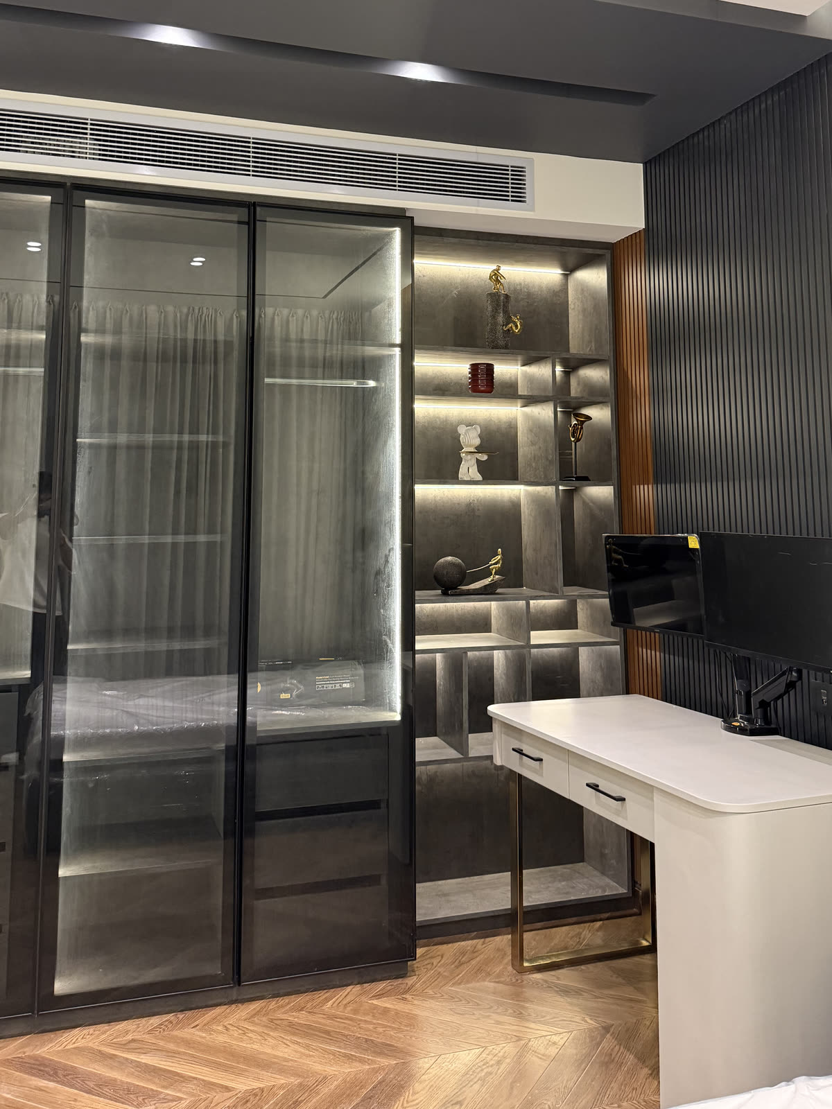 Hyde Park villa dressing room with lit glass wardrobes
